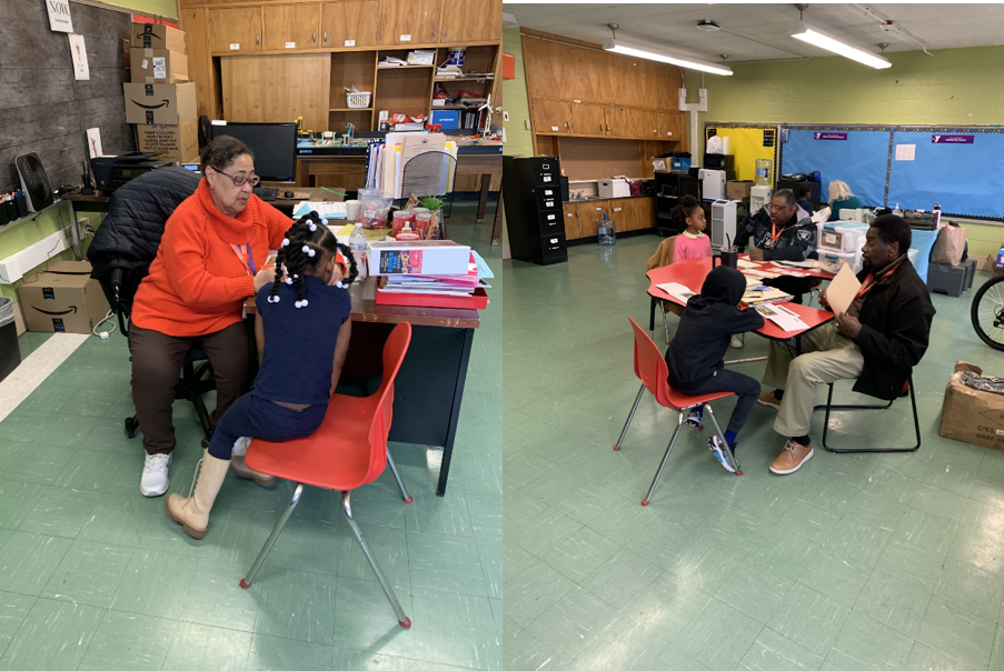 Volunteers reading to kids